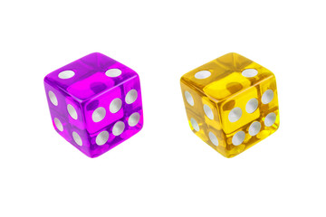 Two colors of dice: purple and yellow. Dice closeup isolated on white.