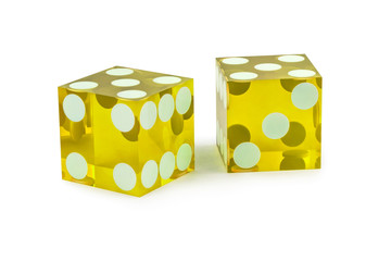 Two yellow professional game dice closeup isolated on a white background / five and five with a light shadow.