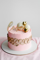 Naked wedding birthday cake. Rustic layer homemade cake with cream. Dessert decorated with chocolate and fruits. Selective focus. Piece of cake. Vegan raw cake.