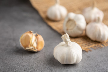 Garlic on the black table. High angle view.