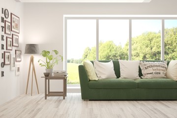 Stylish room in white color with sofa and summer landscape in window. Scandinavian interior design. 3D illustration