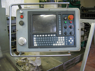 Closeup of control panel of old CNC center.