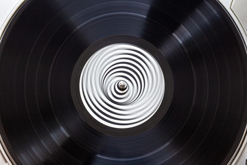Black vinyl record on a turntable