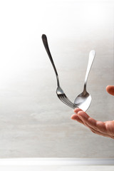 hand with fork and spoon