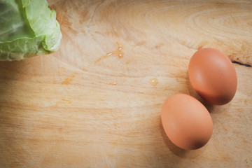 fresh cabbage organic vegetable and egg put on wood cutting board in kitchen prepare cooking food