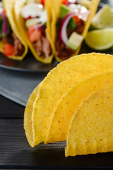 Folded empty corn tortillas, selective focus. Cooking tacos
