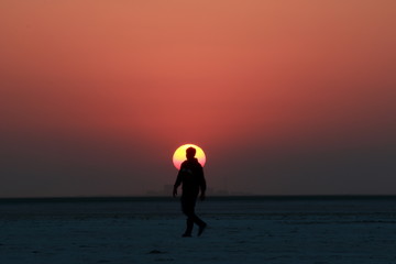 Silhouette of man during sunset at Rann of Kutch