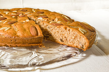 Zelten, rustic South Tyrolean cake on white tablecloth.