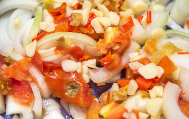 Onion salad with garlic tomatoes and peppers