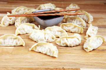 Gyoza or dumplings snack with soy sauce.
