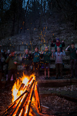 Scouts around fireplace