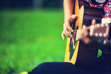 close up of girl hand playing guitar