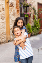 Two children hugging on a spring day