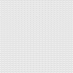 Seamless knitted white pattern. Winter handycraft background