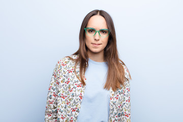 young pretty woman feeling clueless, confused and uncertain about which option to pick, trying to...