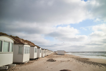 Fototapeta na wymiar A row of beach cabins