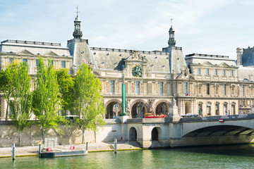 Naklejka premium Paris cityscape of Louvre historical building, bridge, river