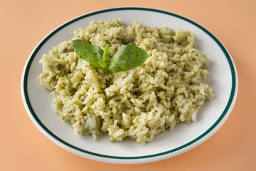 Traditional Mexican Arroz Verde green rice dish made of long-grain rice, spinach, cilantro and garlic