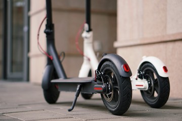 Fototapeta na wymiar Modern electric scooter parking on the street.
