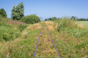 Fototapeta na wymiar Railroad tracks in Modlimowo village located in West Pomerania region of Poland