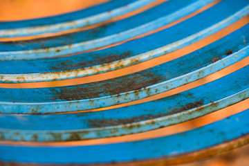 Rusty metal seat of a swing