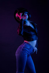 High Fashion model woman in underwear in colorful bright lights posing, portrait of a beautiful girl. Artistic colorful design. Party concept