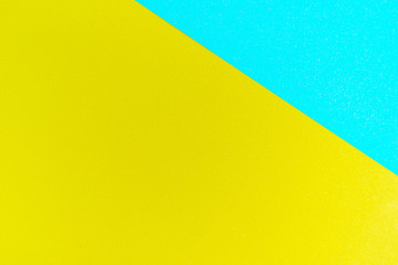 Texture of a blue and yellow paper for background.