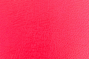Texture of a red leather background.