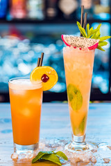 Close-up of orange alcoholic cocktails in tall glass