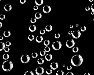 Air balls in water on a black background