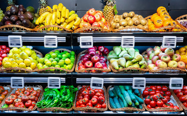 Vegetables and fruits on supermarket shelves