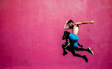 Fototapeta na wymiar boy jumping, throwing flying knee.