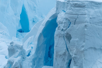 Glacier wall, Paradise Harbor, also known as Paradise Bay, behind Lemaire and Bryde Islands in Antarctica.