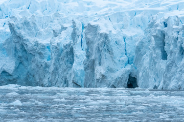 Glacier wall, Paradise Harbor, also known as Paradise Bay, behind Lemaire and Bryde Islands in Antarctica.