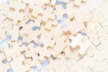 wooden jigsaw puzzle pieces on white background