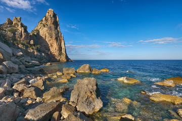Spectacular view of Punta Pedra Longa and azure water in sea.