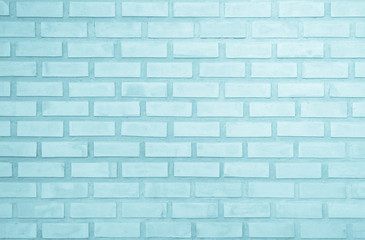 Obraz premium Pastel Blue and White brick wall texture background. Brickwork painted of blue color interior rock old pattern clean concrete grid uneven brick design stack. Home or office design backdrop decoration.