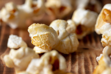 Popcorn flakes on a wooden background