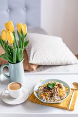 Pearl barley porridge with mushrooms and corn, healthy food concept, breakfast, cup with black coffee