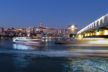 Fototapeta premium Istanbul, Turkey - Jan 10, 2020: Ferry boat in Golden Horn at the Galata Bridge with Galata Tower in background, Istanbul, Turkey, Europe