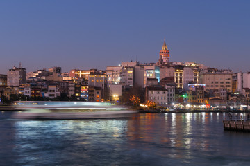 Naklejka premium Istanbul, Turkey - Jan 10, 2020: Ferry boat in Golden Horn with Galata Tower in background, Istanbul, Turkey, Europe