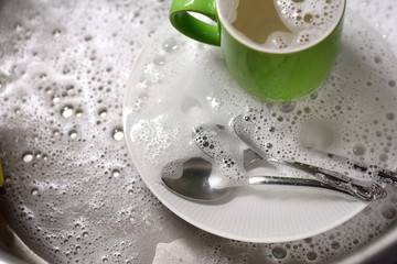 Dish washing. soaking in the kitchen sink. After the Dinner it's time to do the Dishes 