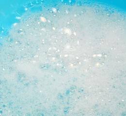Foam bubble from soap or shampoo washing on top view. Foam background. White foam.