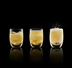 Whisky and soda cocktail triptych on black background.