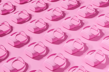 Pink made of black vr headset on the pink background.