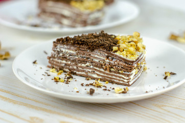 Many layered cheesecake with chocolate and nuts, healthy food