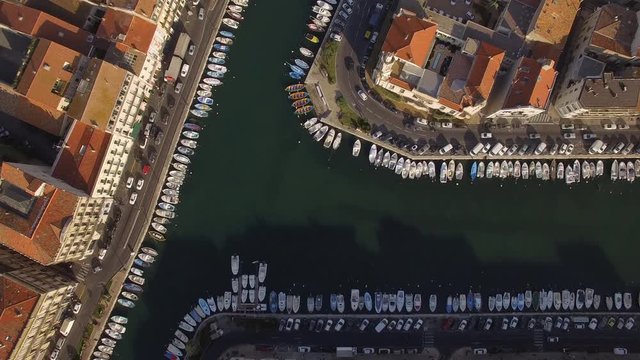 Sunrise top shot on S&egrave;te and its channels in the middle of the city. Nice colors and small fishing boats of the Venice of Languedoc.