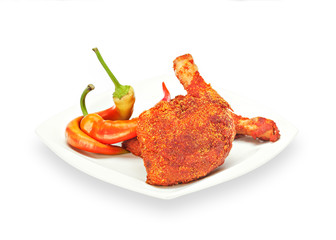 Delicious Crispy chicken quarter in batter with chilly peppers