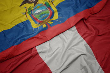 waving colorful flag of peru and national flag of ecuador.