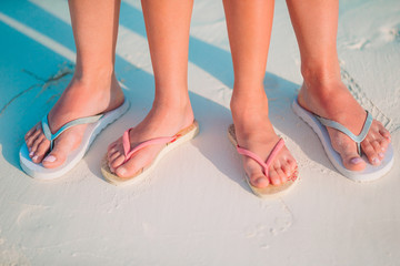 Little girl and happy dad having fun during beach vacation
